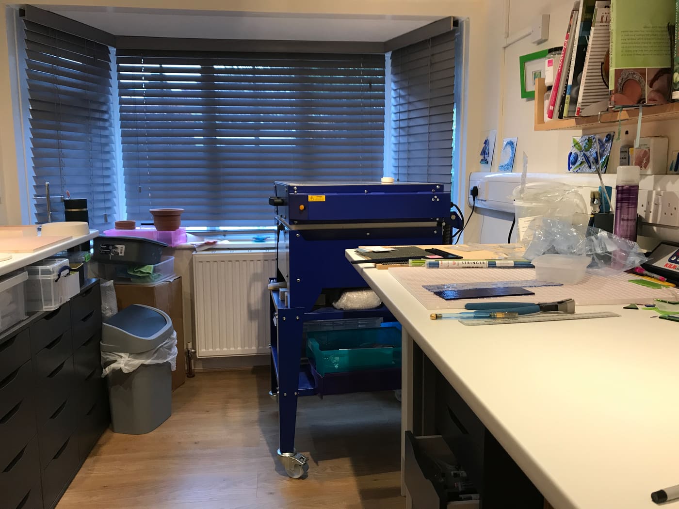 The glass studio with kiln and work bench