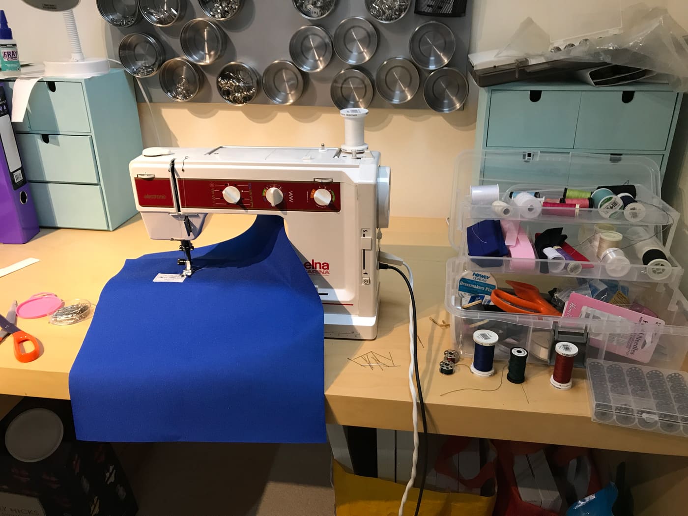 The sewing room with fabrics and sewing machine