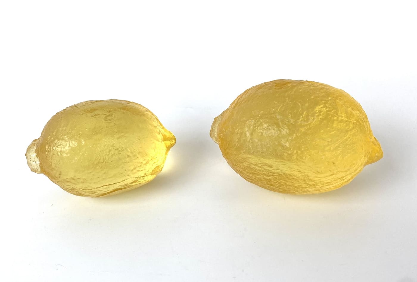 Two cast glass lemons